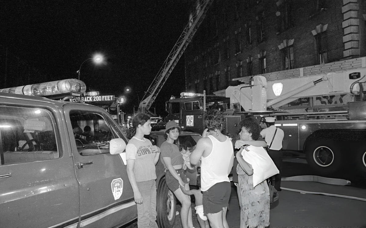Fire Department Trucks And Residents At Fox Street And Longwood Avenue During A Fire At 800 Fox Street, South Bronx, 1984.