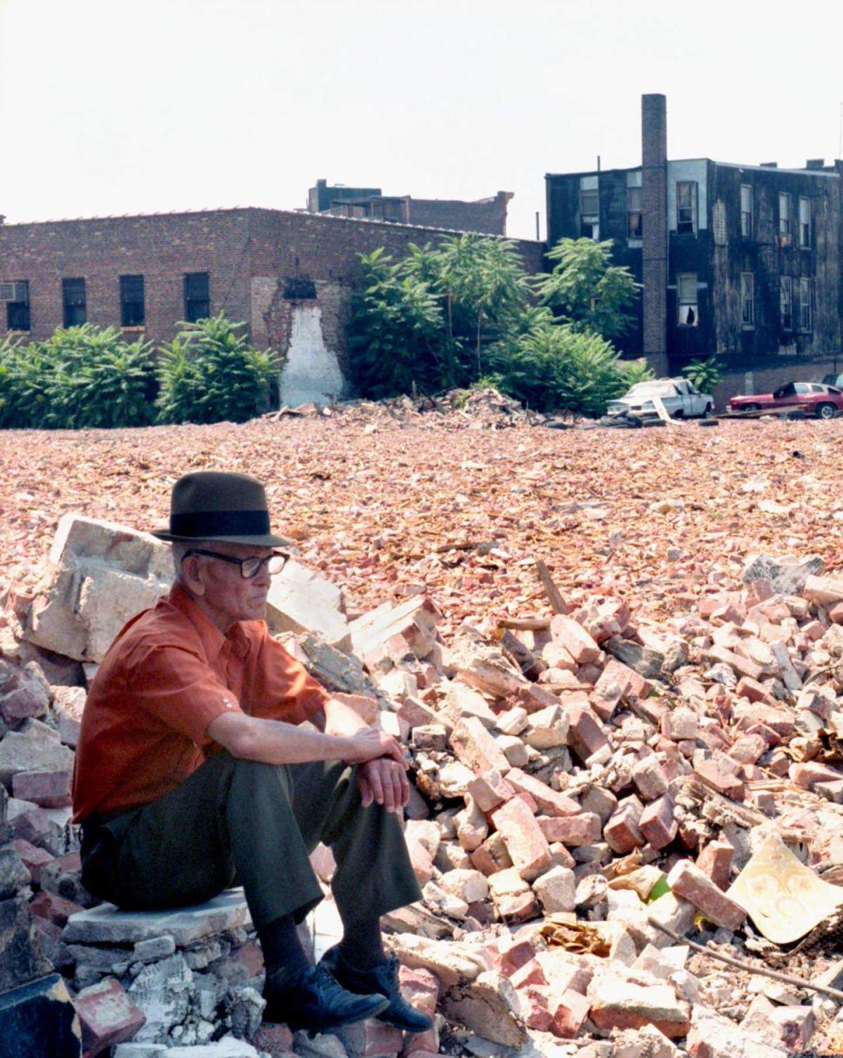 Elderly Man Sitting Among The Rubble Of Tenement Buildings, South Bronx, 1980.