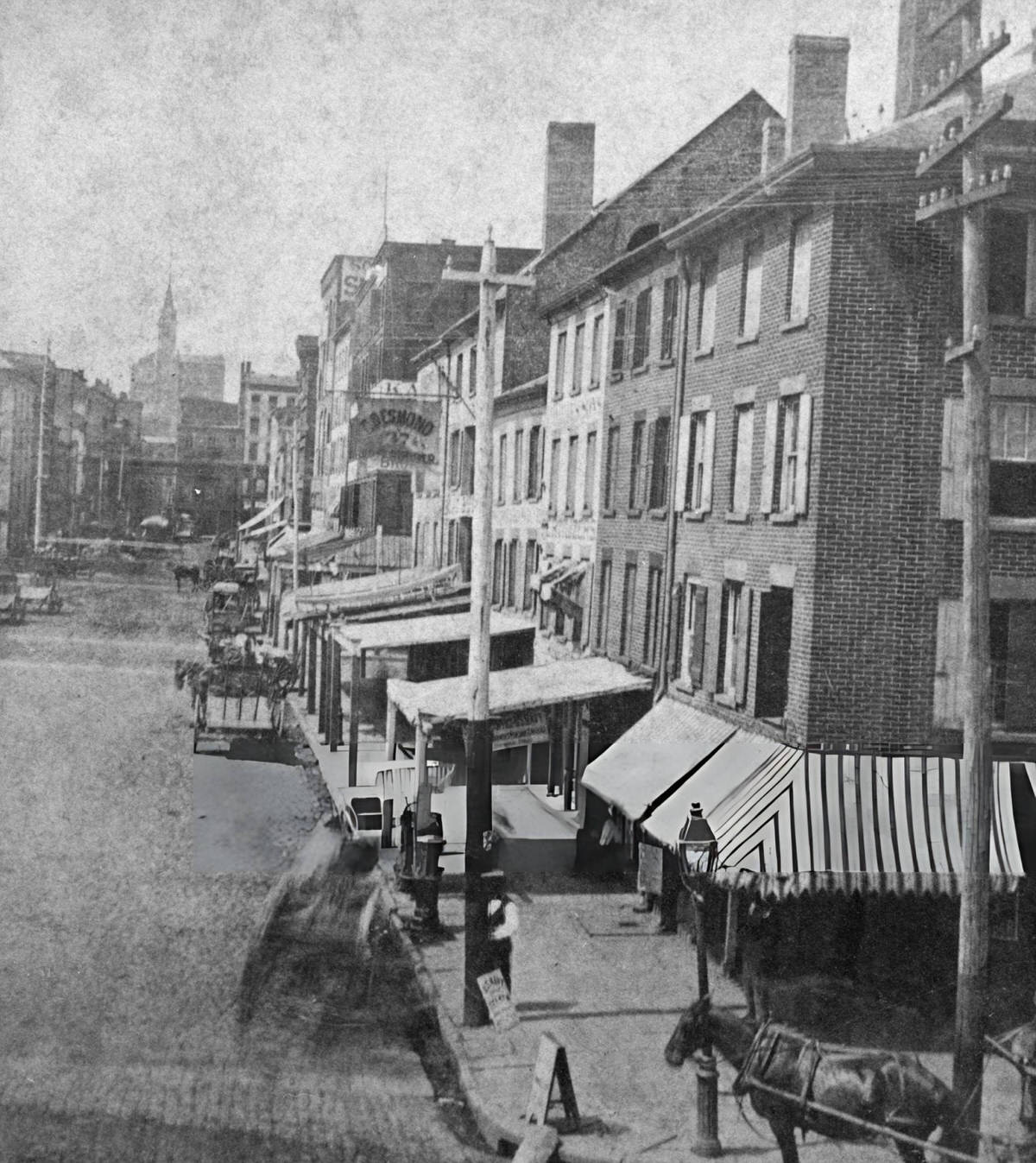 Storefronts With Awnings On South Street, Lower Manhattan, 1885.