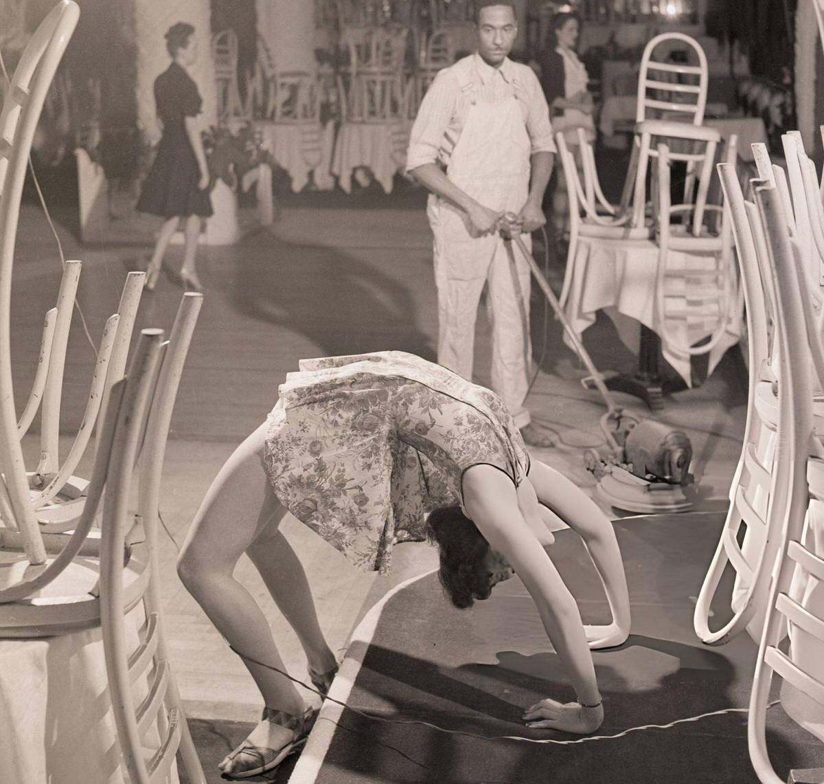 Dancer Pat Patrick Performing Among Stacked Tables And Chairs At The Copacabana, New York, 1942.