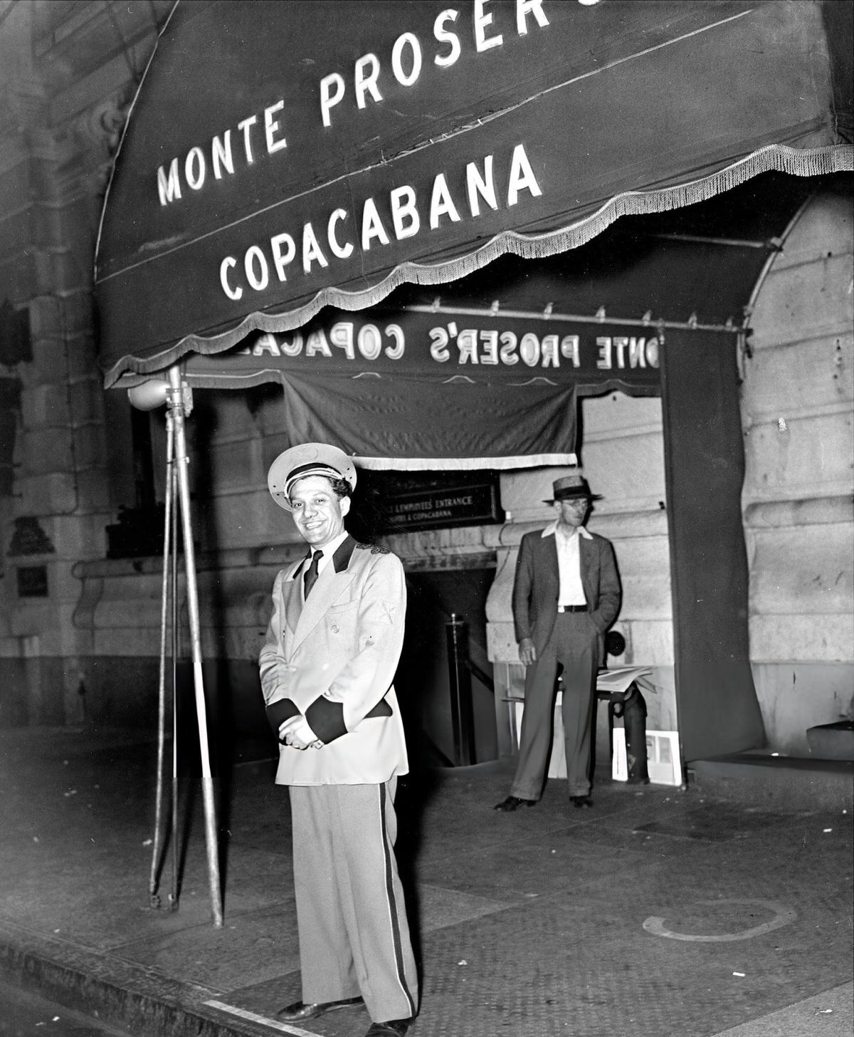 Doorman Harry Schwartz In Front Of The Copacabana At 10 East 60Th Street, New York.