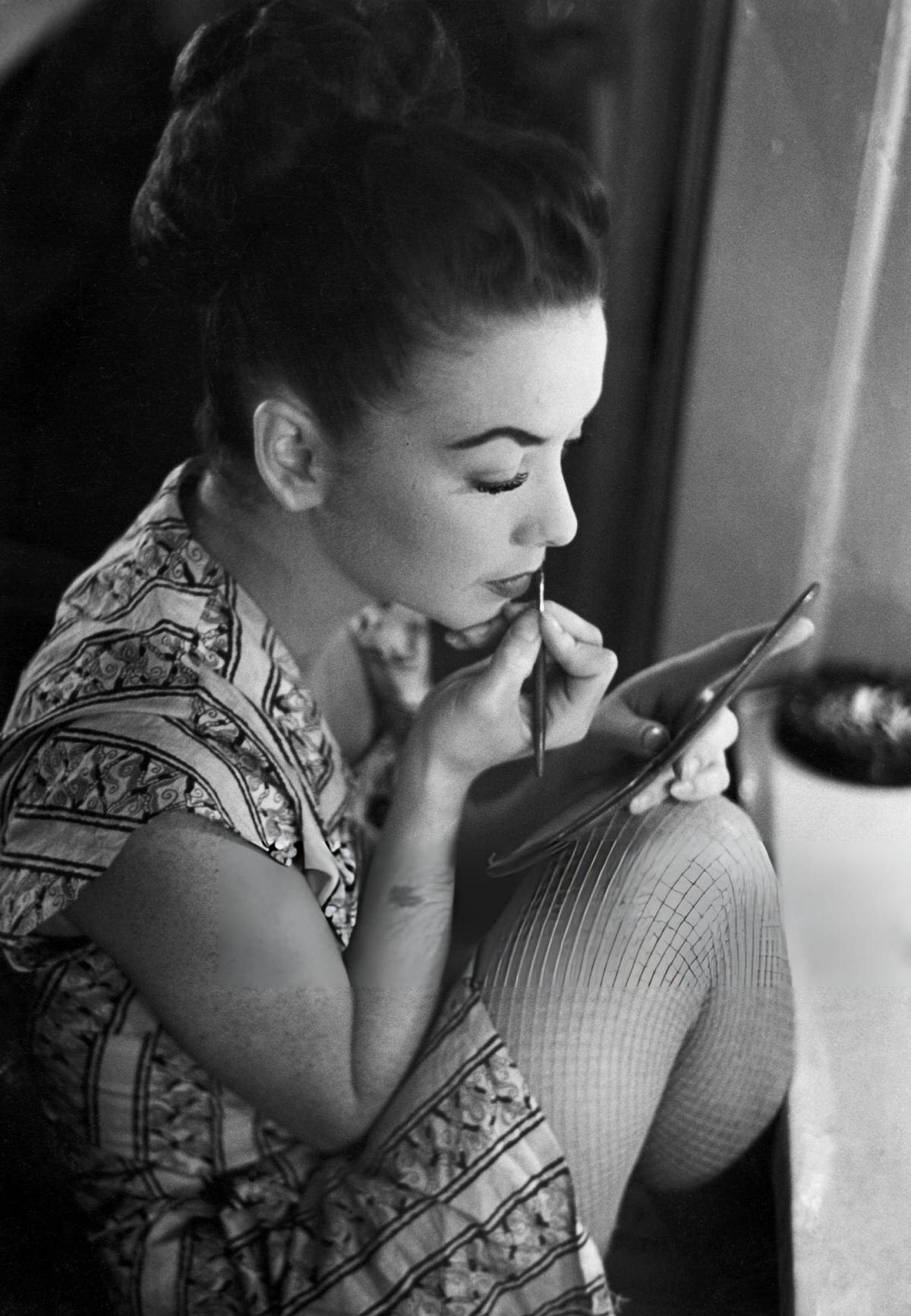 Dancer Applying Makeup In Her Dressing Room At The Copacabana, New York.