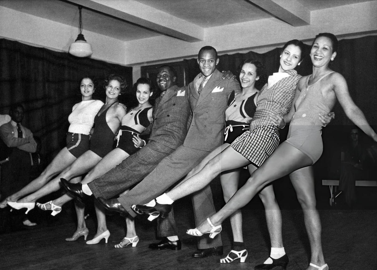 Olympic Athlete Jesse Owens Dancing With Bill Robinson And Performers At The Cotton Club, New York, 1936.