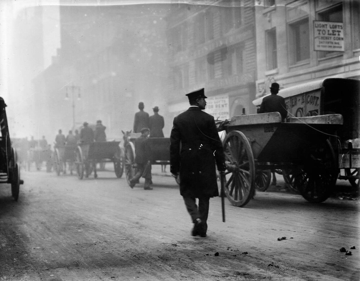 Police Protecting Garbage Carts During A Strike, New York, 1911.