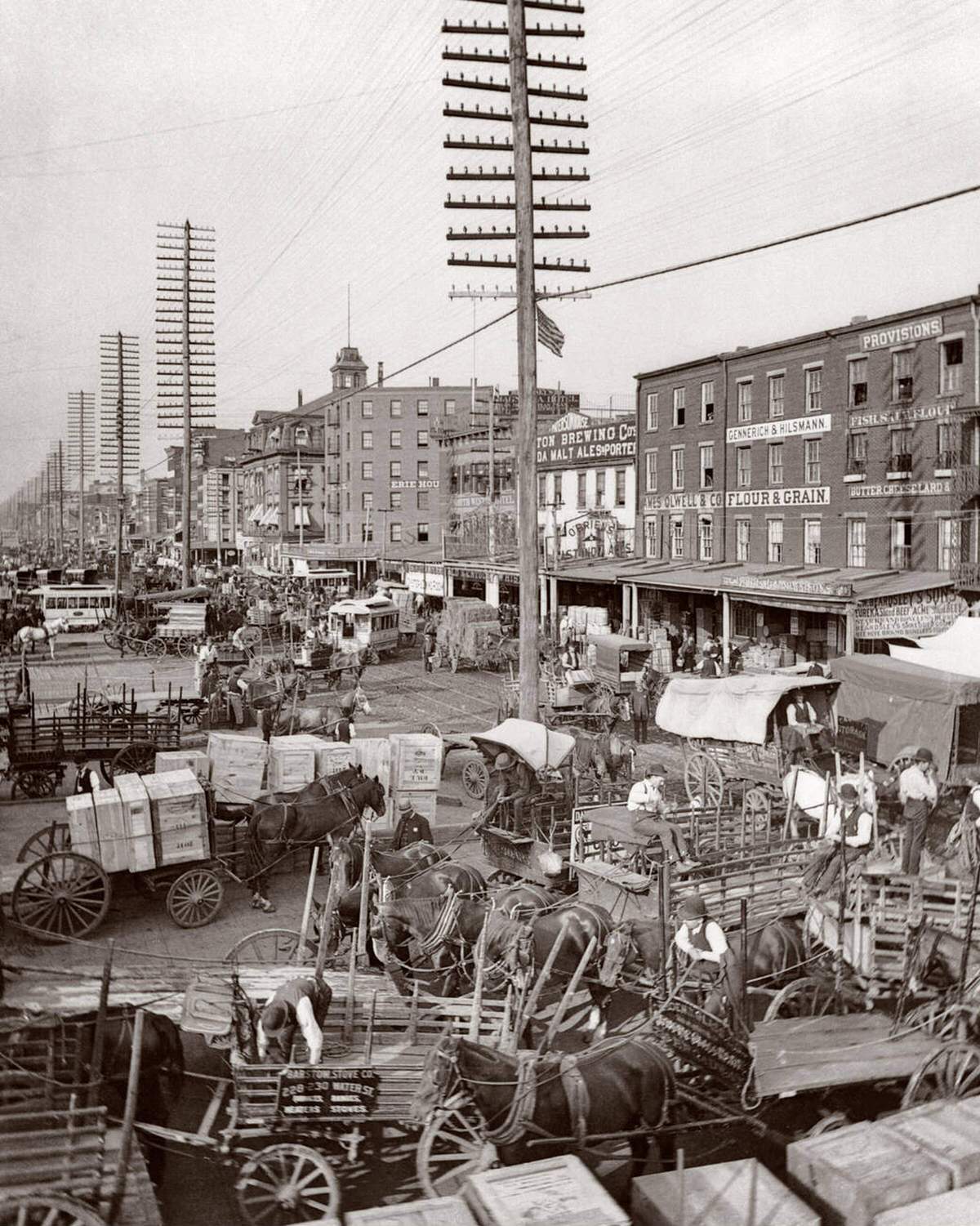 Horse-Drawn Wagons And Utility Poles On West Street, New York, 1883.