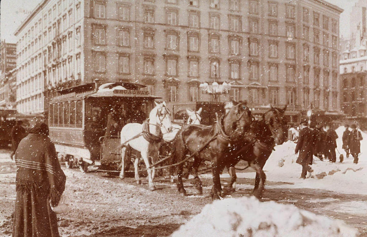 Horse-Drawn Car Passing A Woman At Madison Square During The Blizzard Of 1899, New York, 1899.