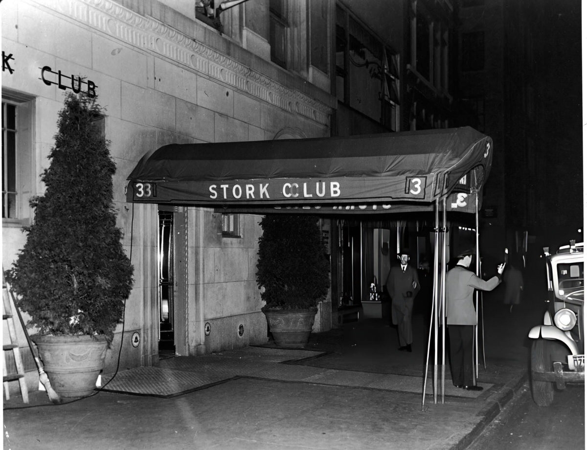 Doorman Hailing A Taxi In Front Of The Stork Club, New York, 1935.