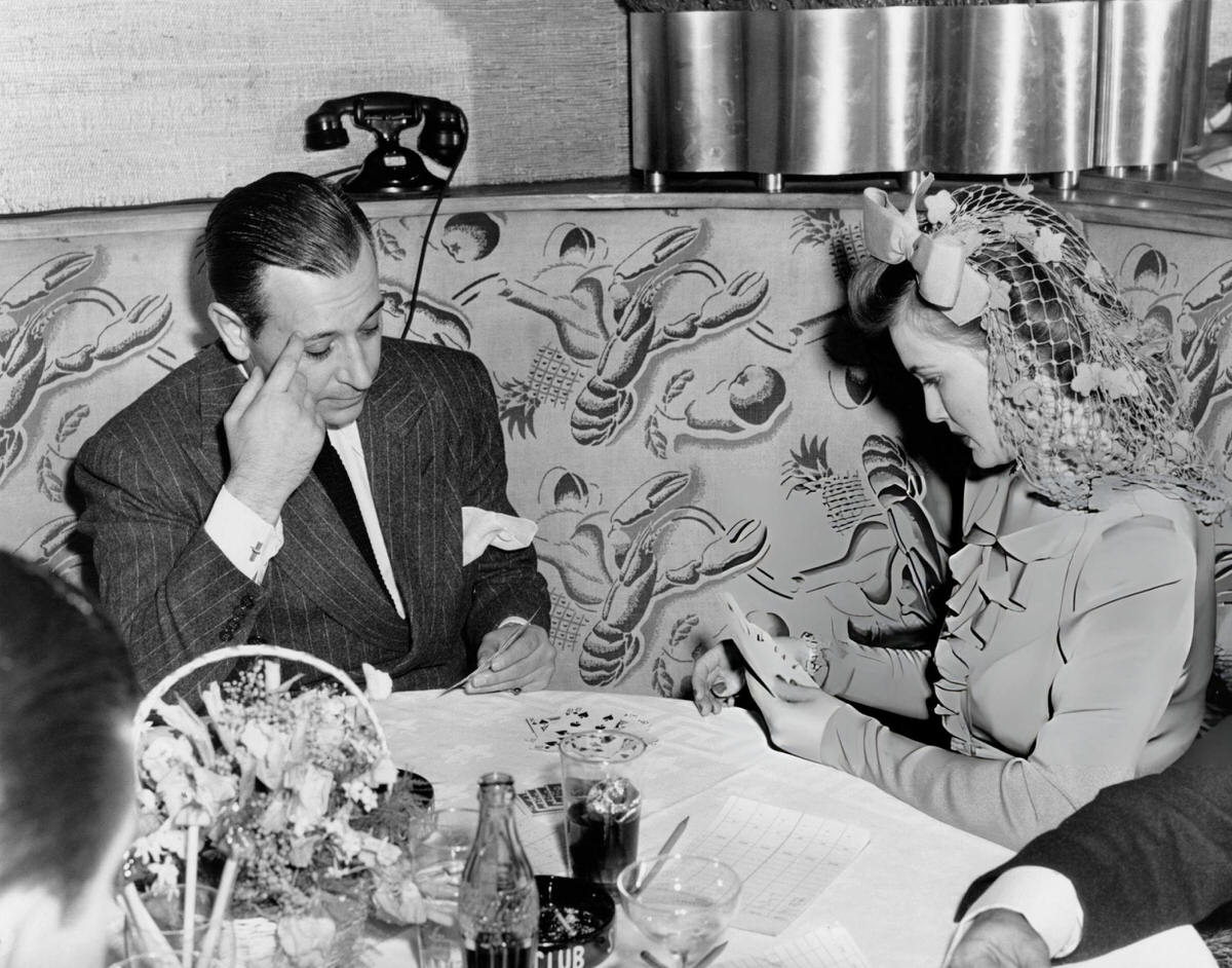 George Raft And Lois Andrews Jessel Playing Gin Rummy In The Cub Room Of The Stork Club, New York, 1942.