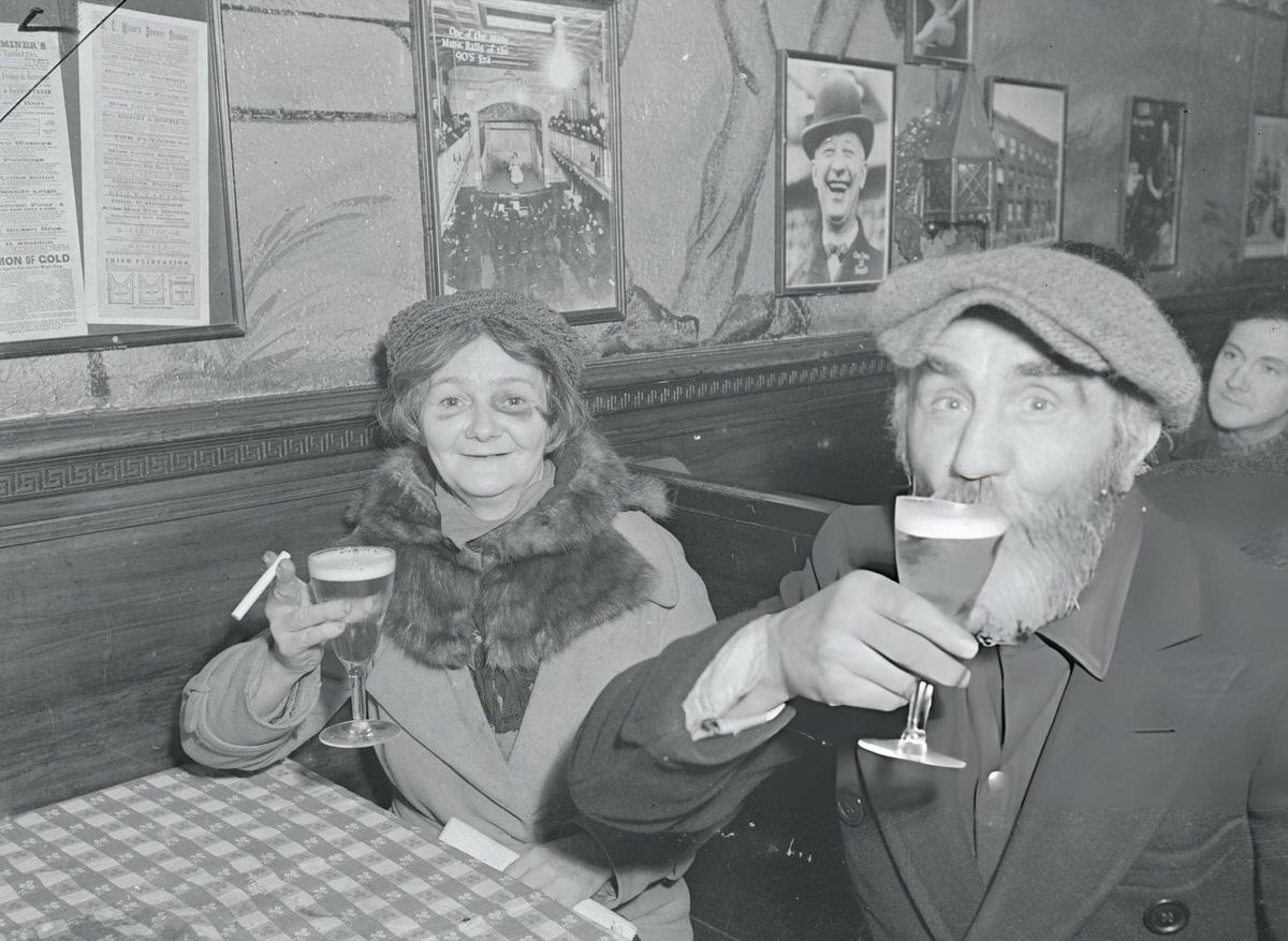 Elderly Man And Woman Drinking Beer In A Booth, 1940S