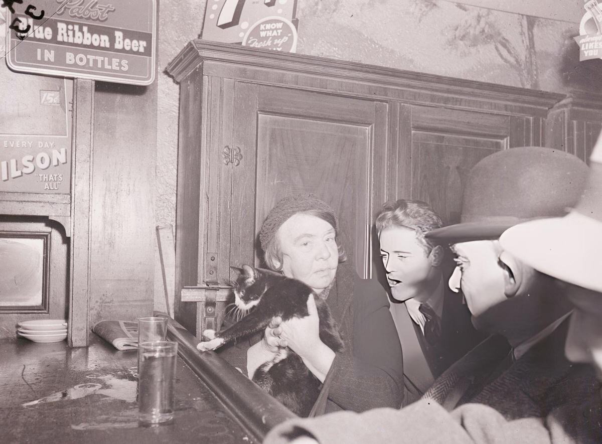 Woman Holding A Cat At The Bar, 1940S