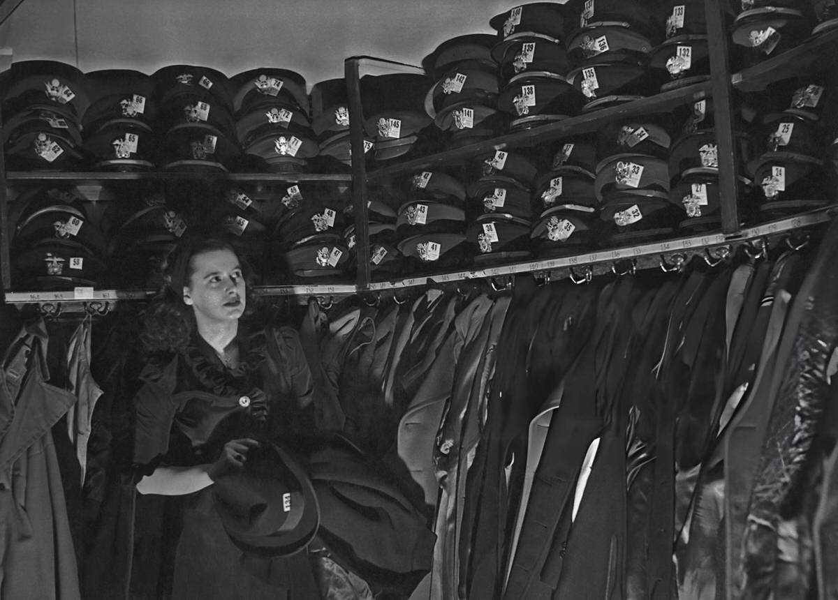 Hat Check Girl Working In A Cloakroom Filled With Military Hats At The Stork Club, New York, 1940S.
