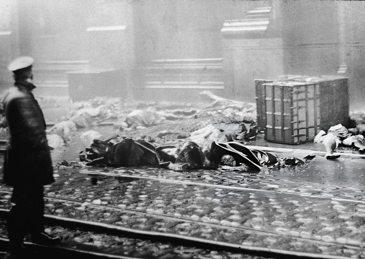 Policeman Observing Charred Rubble And The Remains Of Workers Following The Triangle Shirtwaist Company Fire, New York, 1911.