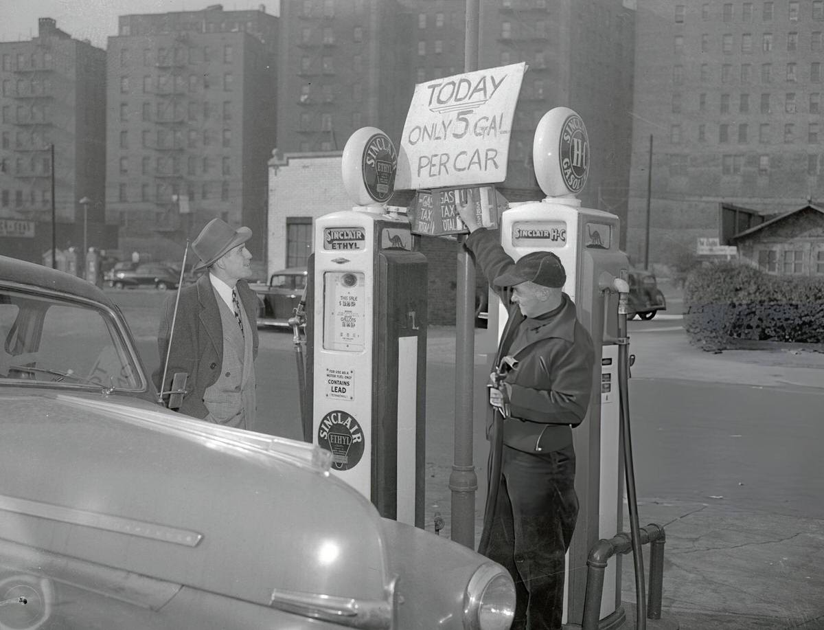 Gas Station Owner Scotty Hatton Informing A Customer Of Fuel Allotment Decreases At 167Th Street And Jerome Avenue, Bronx, 1940S.
