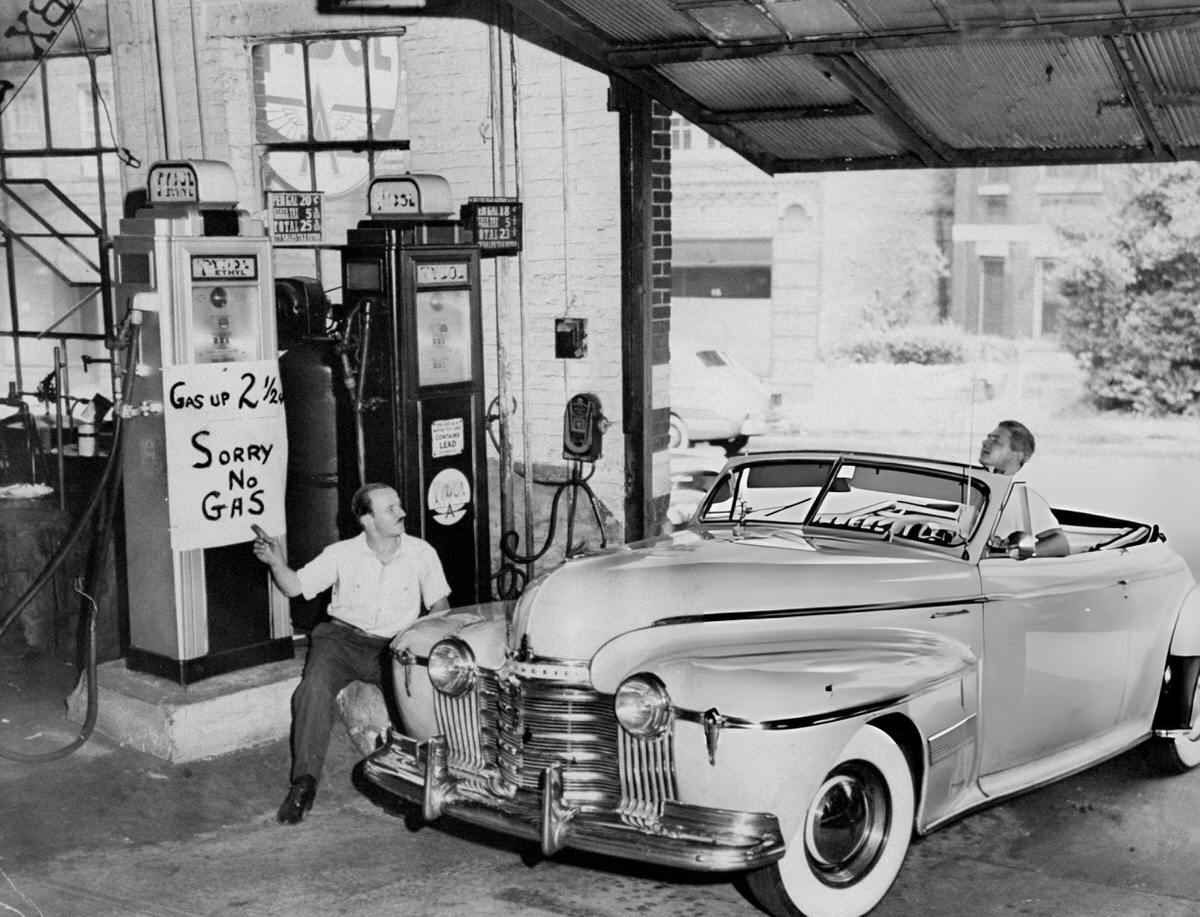 Assistant Manager Jack Rawiszer Informing A Customer Of Price Increases During The World War Ii Energy Crisis, New York, 1940S.