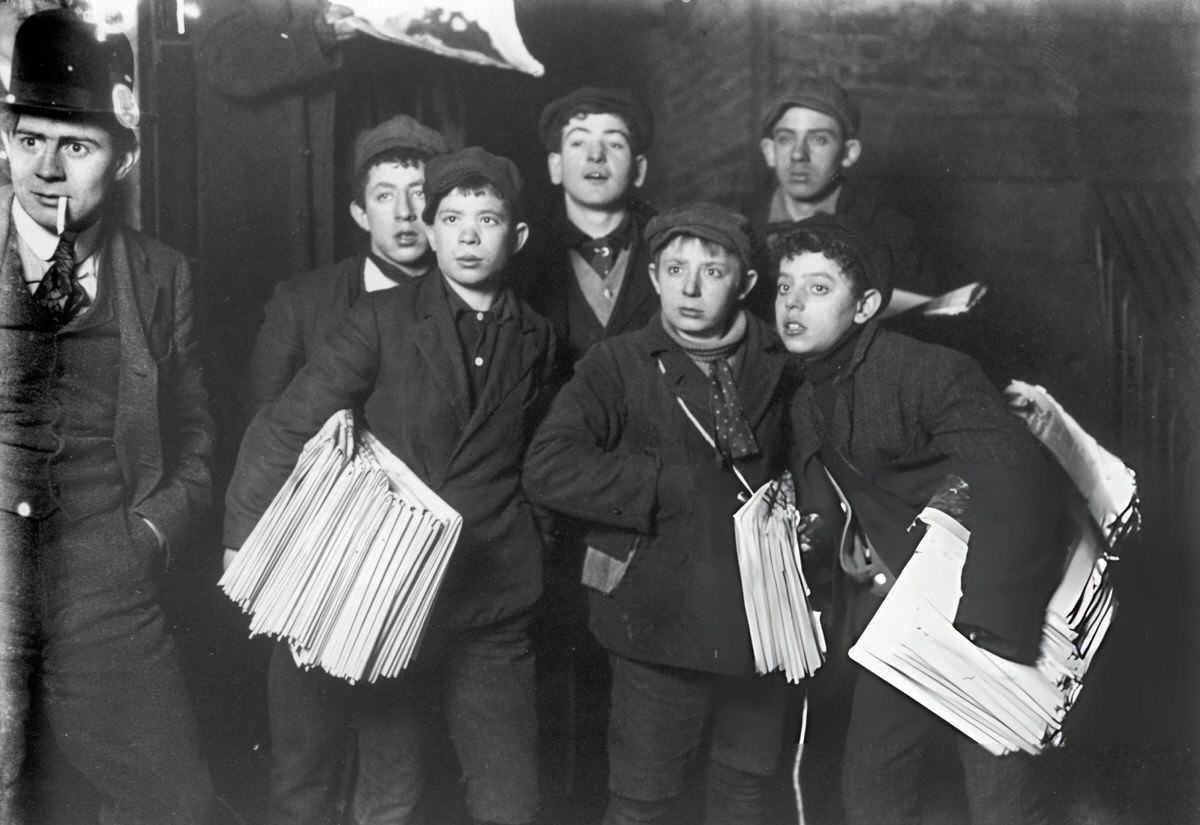 Newsboys Holding Bundles Of Newspapers At Midnight On The Brooklyn Bridge, New York, 1906.