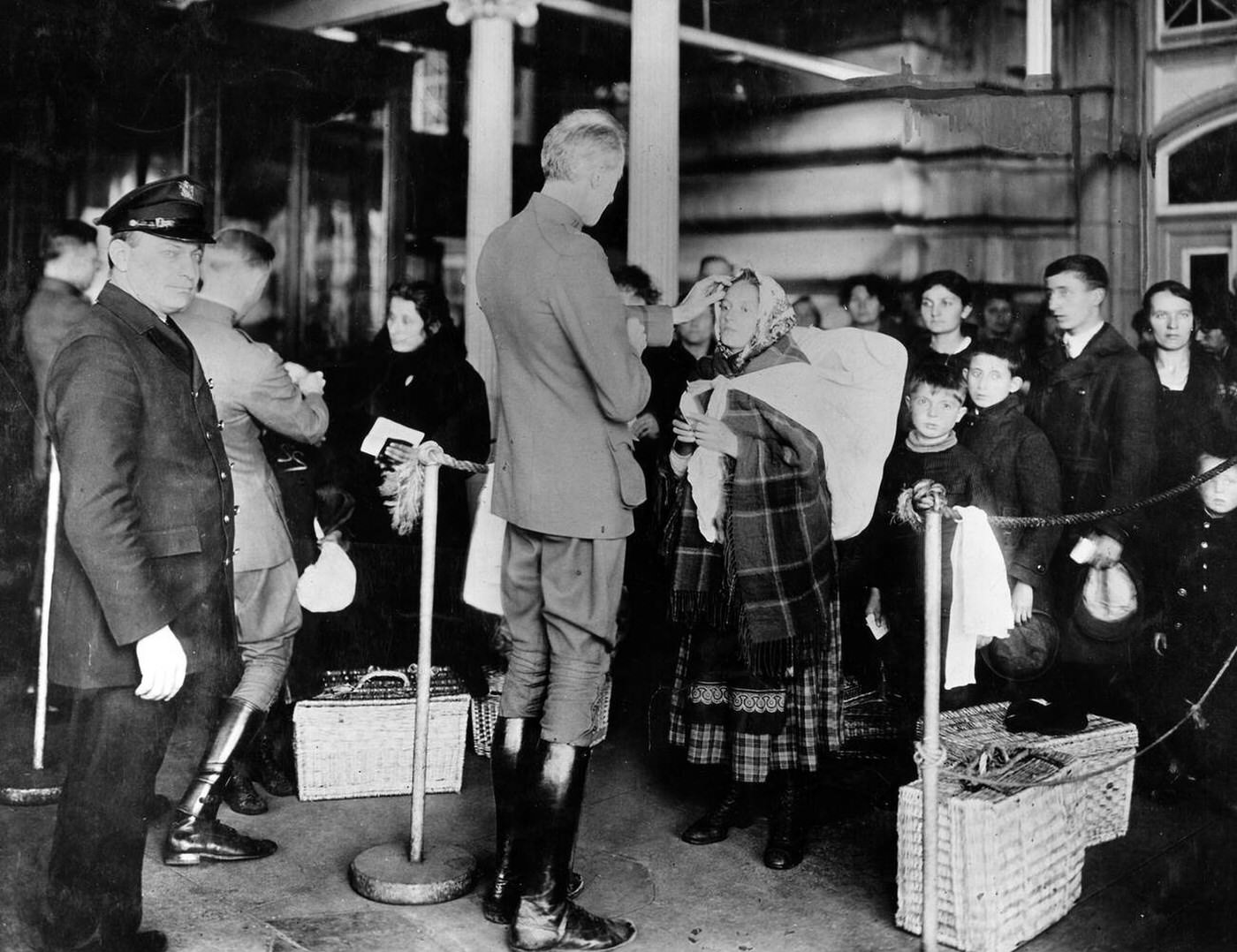 Public Health Service Officers Examining Immigrants At Ellis Island During The Spanish Flu Pandemic, 1918