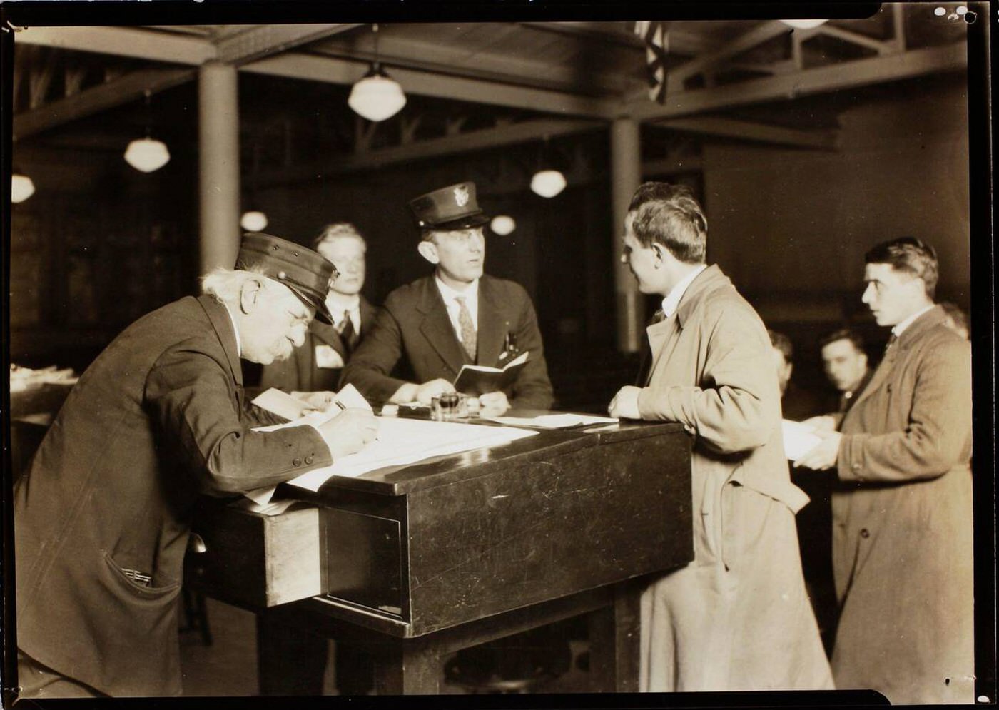 Immigration Officials Documenting And Processing Newly Arrived Passengers At Ellis Island, 1926