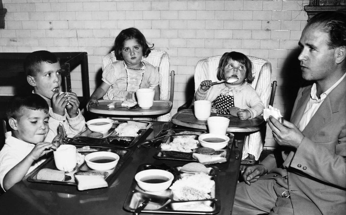 Italian Family Having A Meal While Being Detained At Ellis Island, 1950