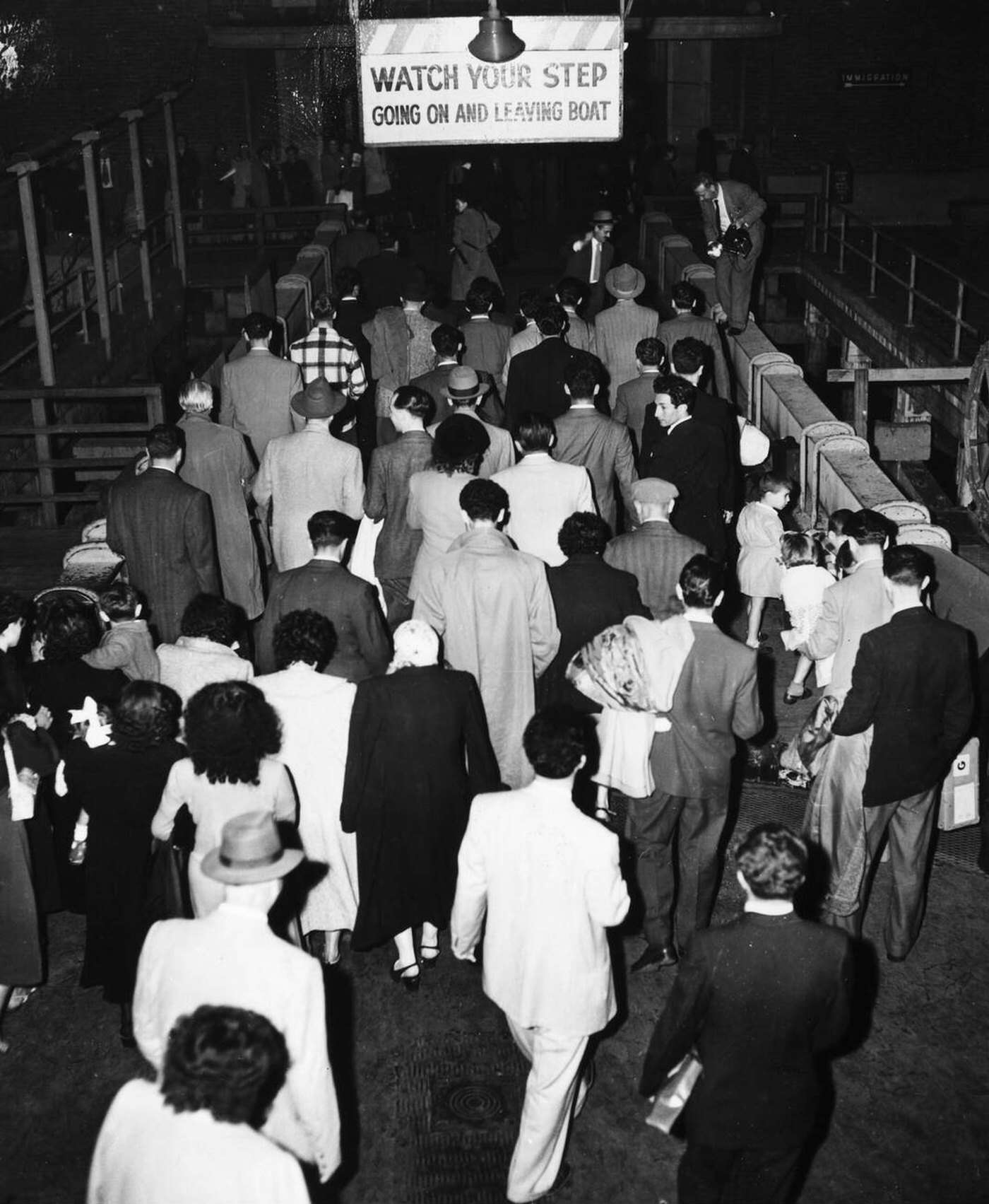 Immigrants Awaiting Screening By Officials At Ellis Island, 1950