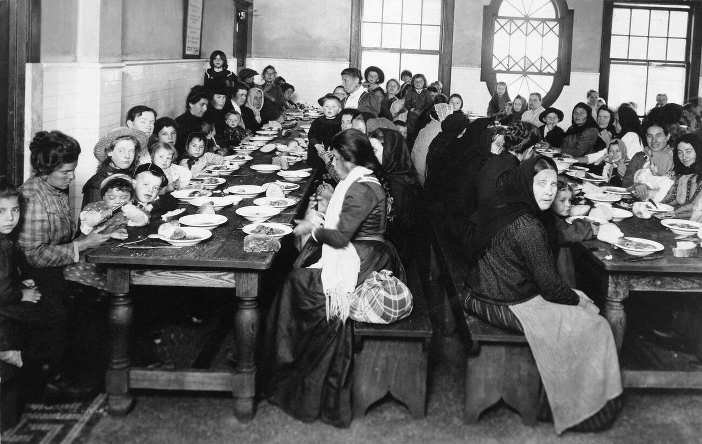 Immigrant Women And Children Having A Meal In The Dining Room At Ellis Island, 1906